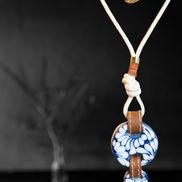 COLLAR LARGO CORDON BEIGE, PIEL Y 2 CIRCULOS DE TALAVERA
